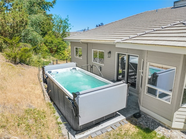 view of pool featuring a hot tub