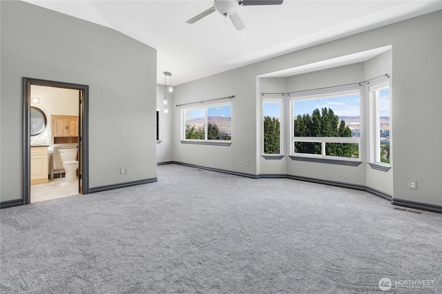 unfurnished bedroom with baseboards, ceiling fan, carpet flooring, and visible vents