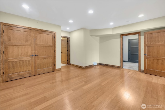 interior space with recessed lighting, baseboards, and light wood-style flooring