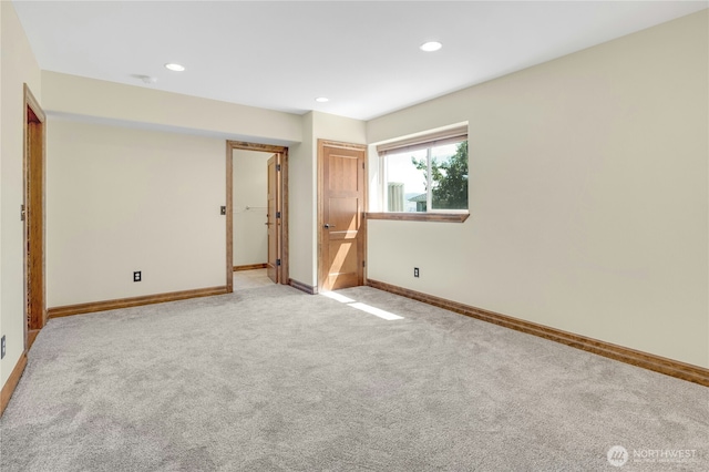 unfurnished bedroom featuring baseboards, recessed lighting, and light colored carpet