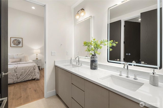 3968 162nd Pl SE, Bellevue, WA 98006 - ensuite bathroom with baseboards, recessed lighting, double vanity, and wood finished floors