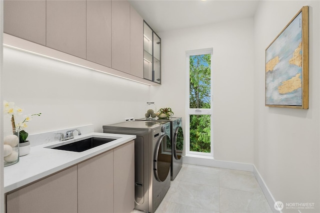 3968 162nd Pl SE, Bellevue, WA 98006 - clothes washing area featuring cabinet space, independent washer and dryer, light tile patterned floors, and baseboards