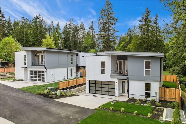 3968 162nd Pl SE, Bellevue, WA 98006 - modern home featuring a balcony, driveway, a garage, and central air condition unit