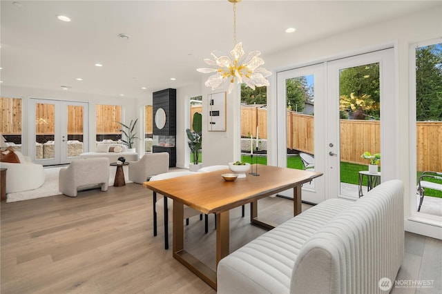 3968 162nd Pl SE, Bellevue, WA 98006 - dining area featuring french doors, recessed lighting, light wood finished floors, and a chandelier