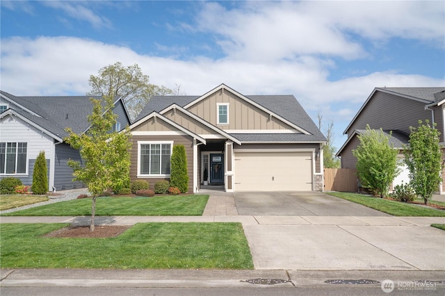 craftsman-style house with fence, stone siding, a garage, board and batten siding, and driveway