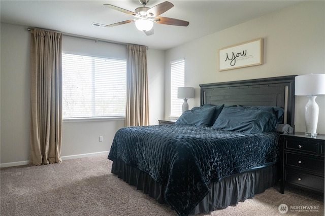 bedroom featuring baseboards, multiple windows, carpet flooring, and visible vents