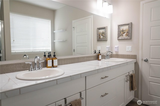bathroom with double vanity and a sink