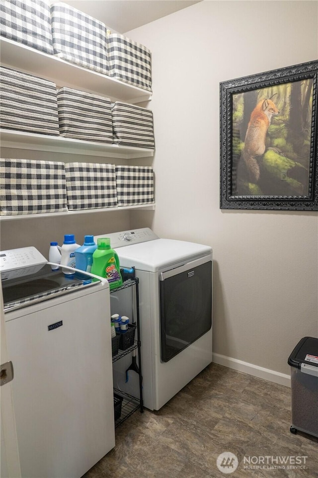laundry room featuring independent washer and dryer, laundry area, and baseboards
