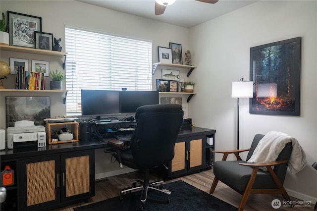 office area featuring baseboards, a ceiling fan, and wood finished floors