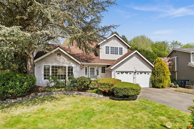 traditional home featuring driveway, a front lawn, and a garage