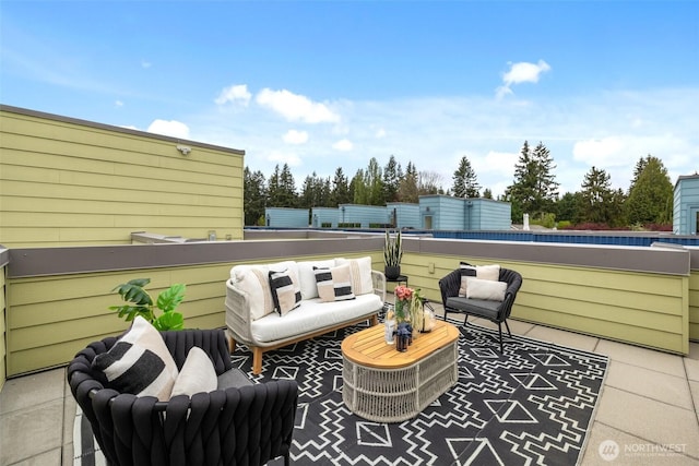 view of patio featuring a balcony