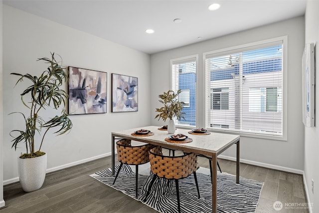 dining room with baseboards, recessed lighting, and wood finished floors