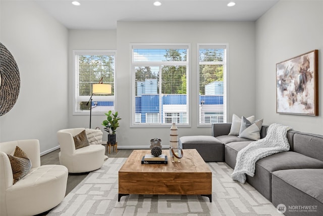 living room featuring recessed lighting and baseboards