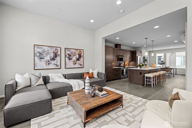 living room featuring recessed lighting and light wood finished floors