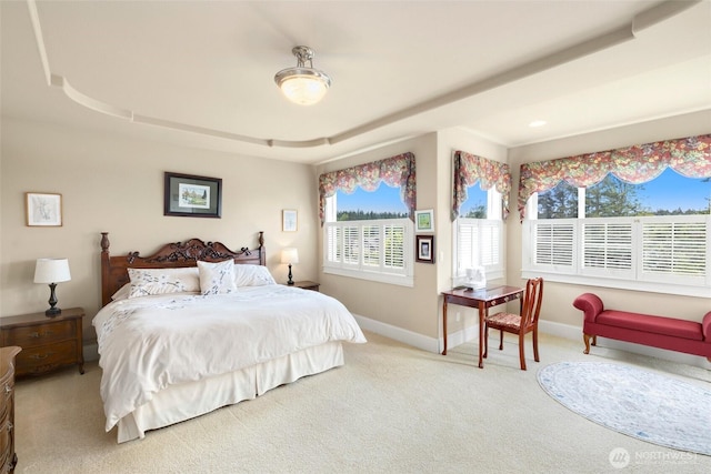 bedroom featuring baseboards and carpet flooring