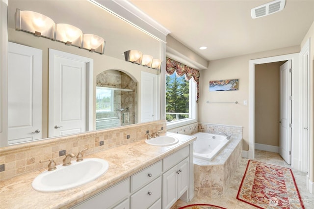 full bathroom with visible vents, a shower stall, a sink, and a bath