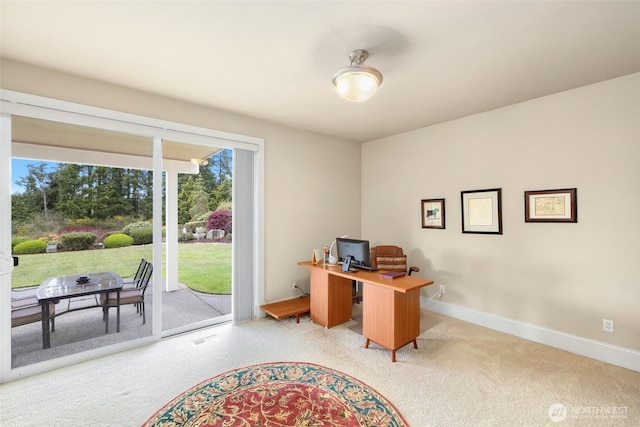 home office with baseboards, visible vents, and carpet