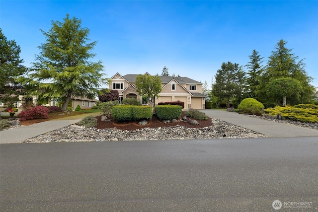 view of front of home featuring a garage and driveway