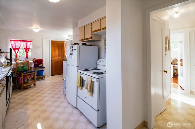 kitchen with light countertops, light floors, and white electric range