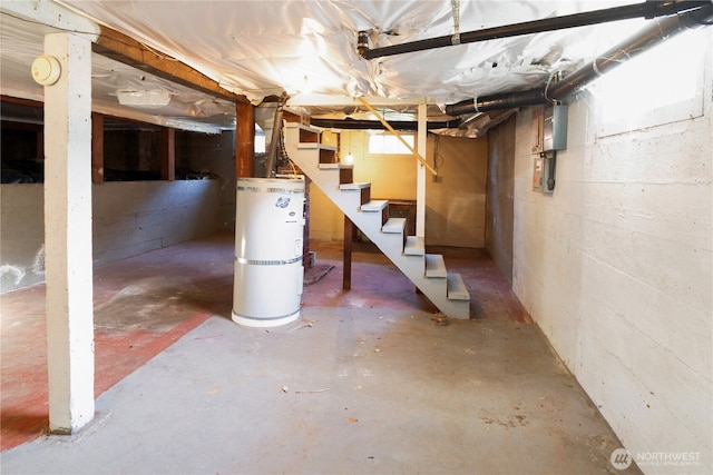 below grade area featuring secured water heater and stairway