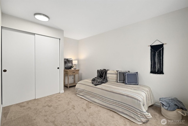 carpeted bedroom featuring a closet