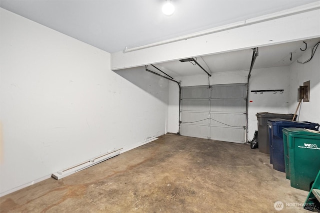 garage featuring a garage door opener and a baseboard radiator