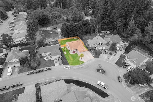 birds eye view of property with a wooded view and a residential view