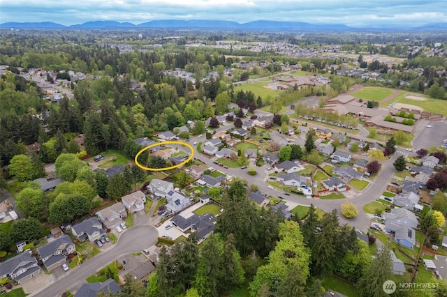 aerial view featuring a mountain view and a residential view
