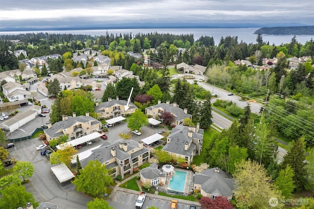 birds eye view of property featuring a residential view and a water view
