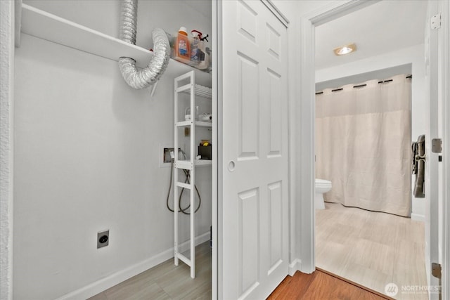 walk in closet featuring light wood finished floors