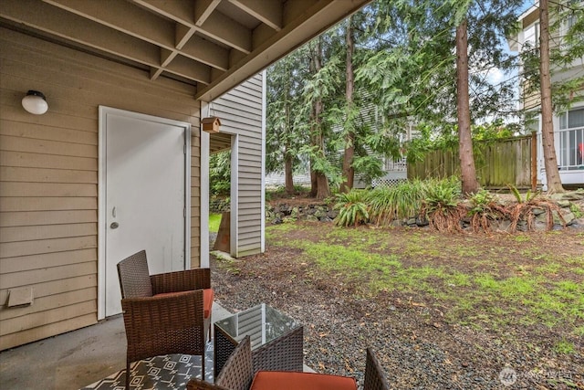 view of yard with fence and a patio