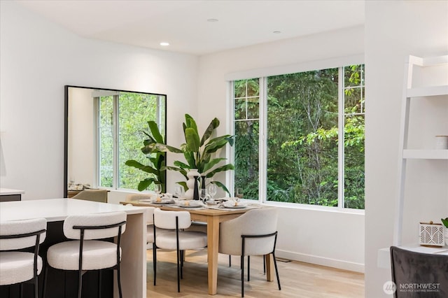 dining area featuring recessed lighting and light wood-type flooring