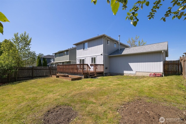 1507 Fruitland Dr, Bellingham, WA 98226 - rear view of property featuring a wooden deck, a vegetable garden, and roof with shingles