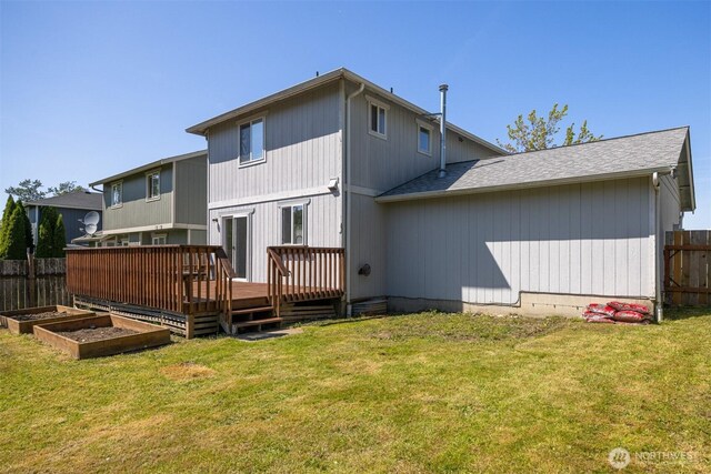 1507 Fruitland Dr, Bellingham, WA 98226 - rear view of property with a deck, a garden, and a shingled roof