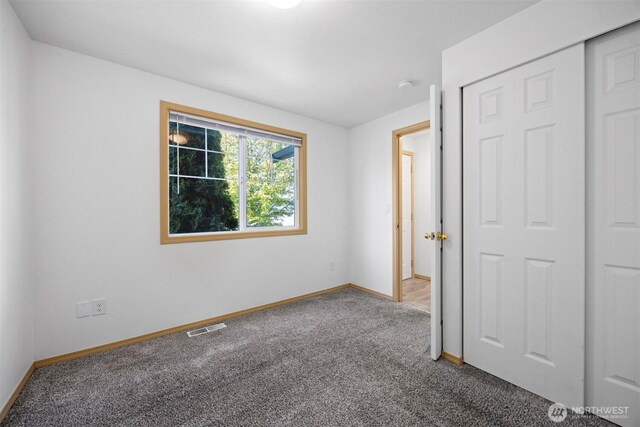 1507 Fruitland Dr, Bellingham, WA 98226 - unfurnished bedroom with carpet flooring, baseboards, and a closet
