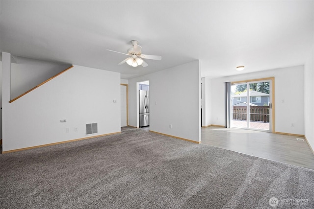1507 Fruitland Dr, Bellingham, WA 98226 - unfurnished living room with carpet flooring, ceiling fan, and baseboards