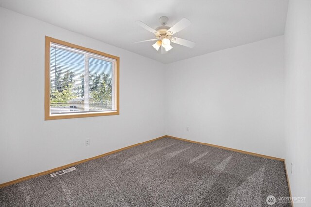 1507 Fruitland Dr, Bellingham, WA 98226 - unfurnished room featuring carpet, baseboards, and ceiling fan