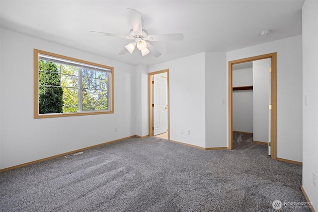 1507 Fruitland Dr, Bellingham, WA 98226 - unfurnished bedroom featuring carpet floors, baseboards, ceiling fan, and a spacious closet
