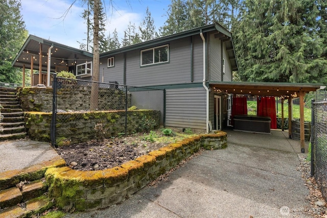 view of home's exterior with fence