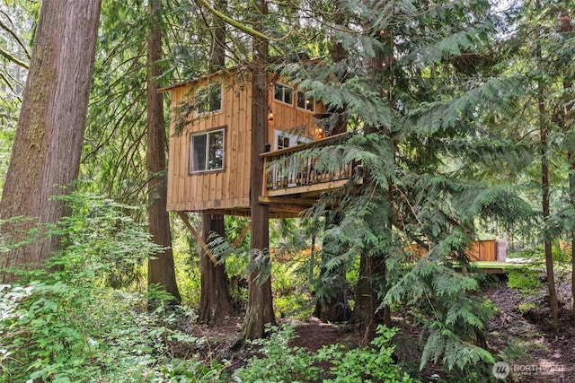 details with a wooded view