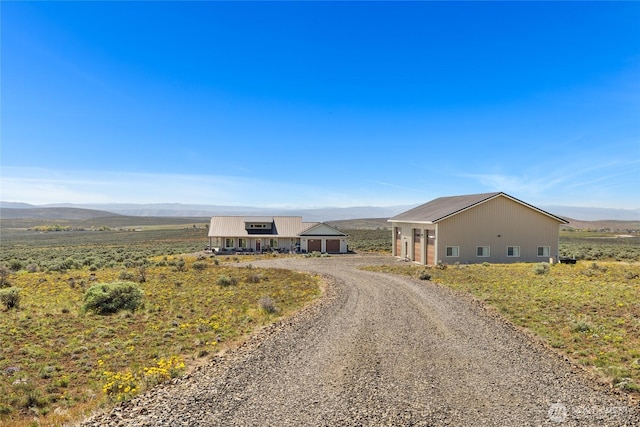 exterior space with a mountain view and driveway