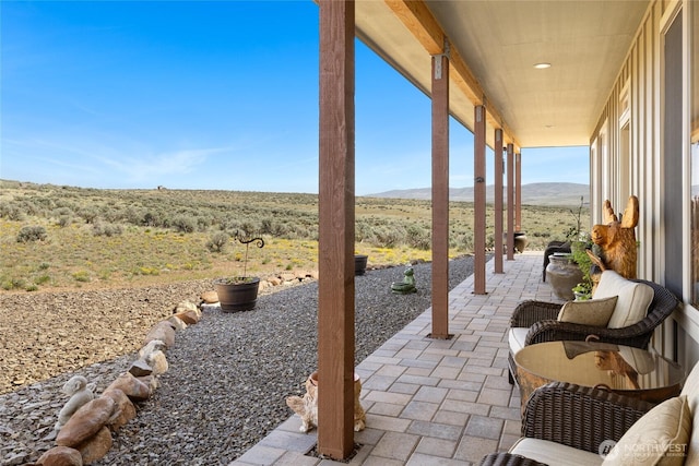 view of patio / terrace with a mountain view