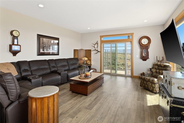 living room with baseboards, recessed lighting, and wood finished floors