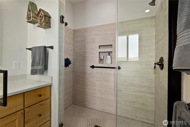 bathroom with tiled shower