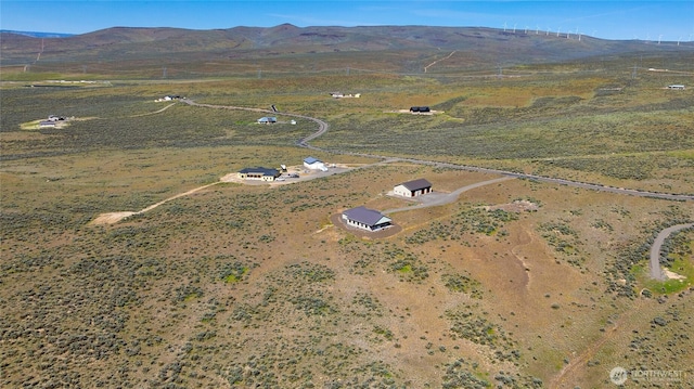 drone / aerial view with a mountain view and a rural view