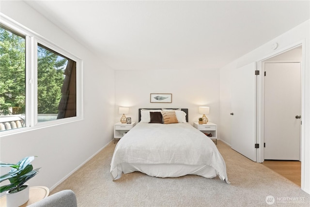 bedroom with light colored carpet