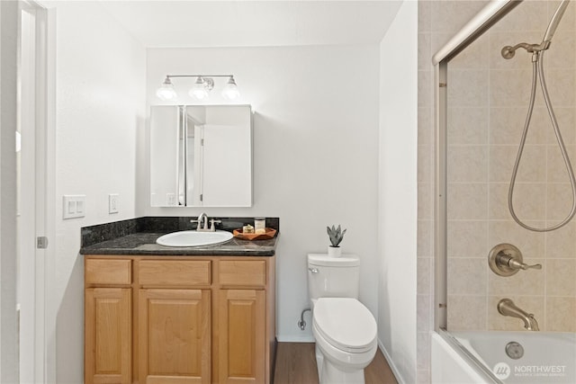full bathroom featuring vanity, tub / shower combination, and toilet