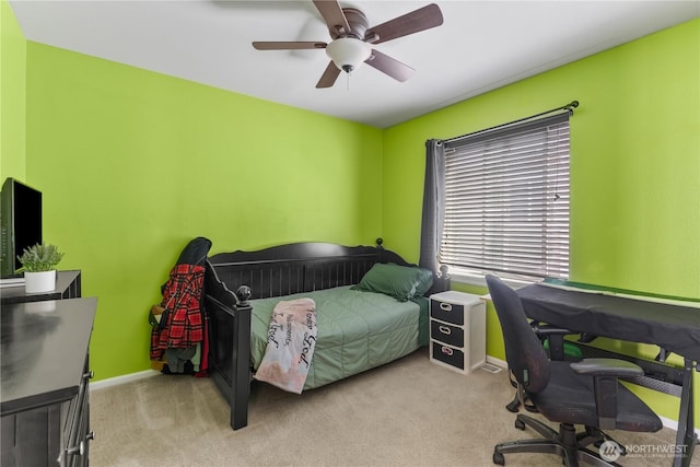 bedroom featuring baseboards, ceiling fan, and carpet floors