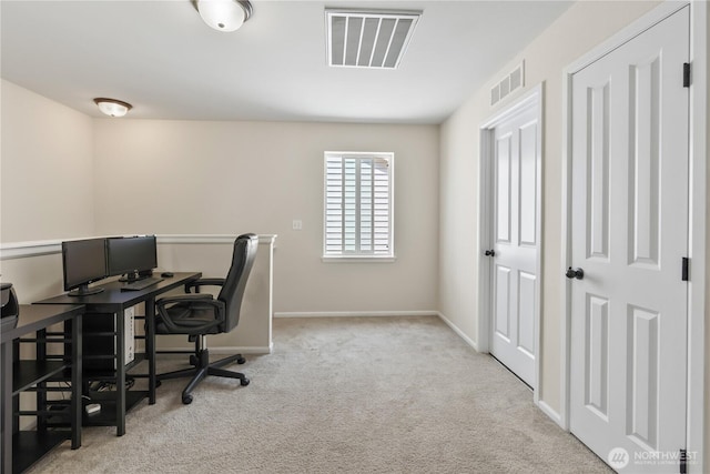 office area featuring visible vents, baseboards, and carpet floors