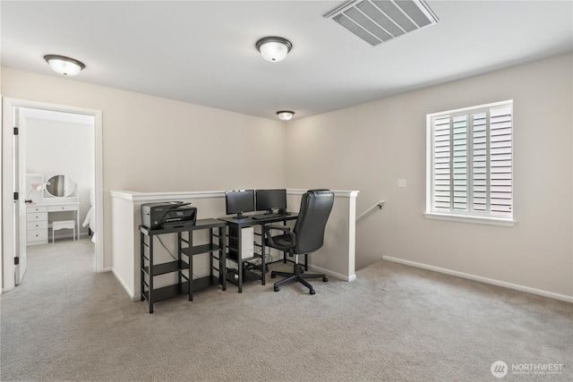 carpeted home office with baseboards and visible vents